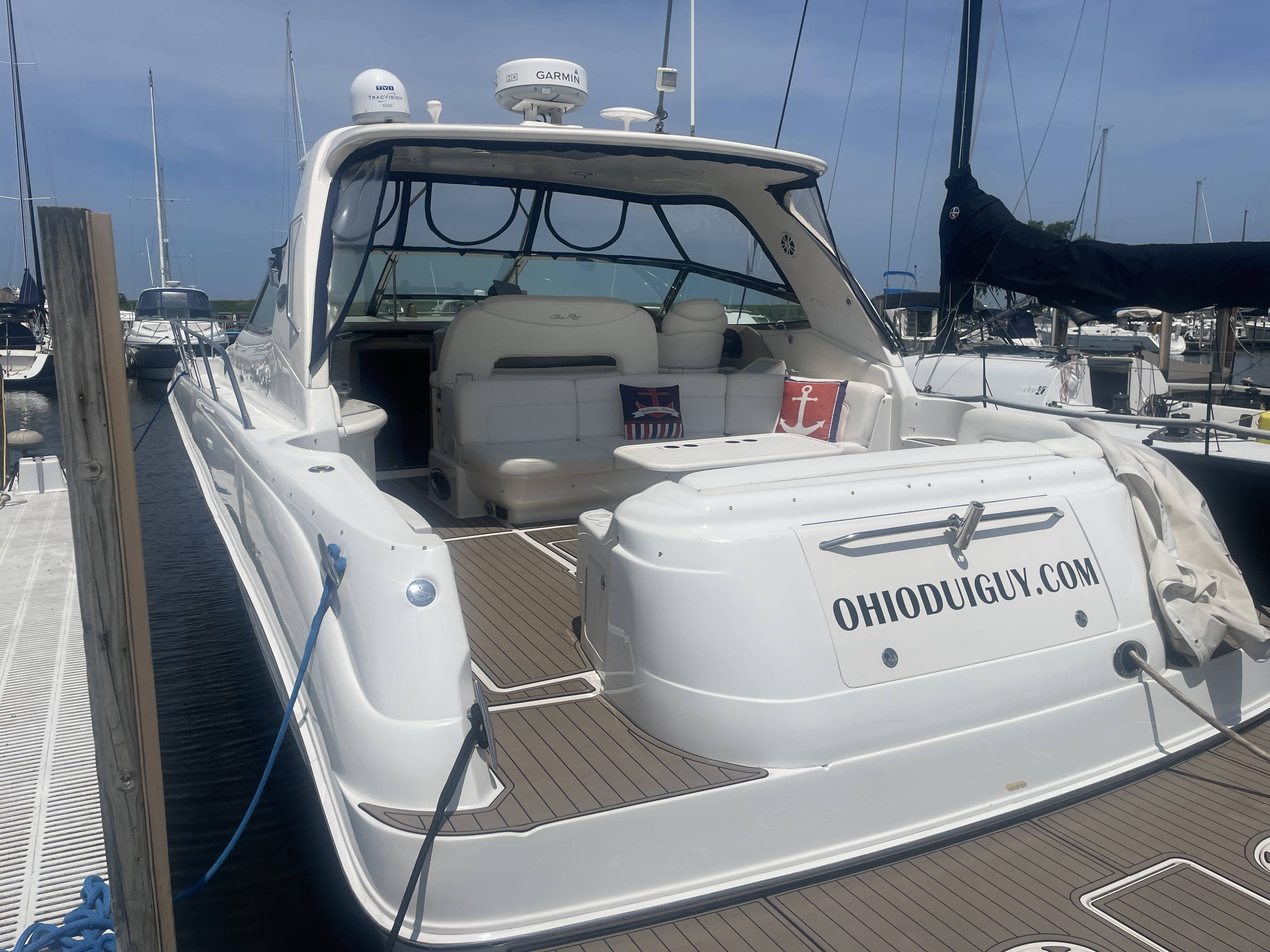 2001 Sea Ray Sundancer 460 cockpit with synthetic flooring and wet bar