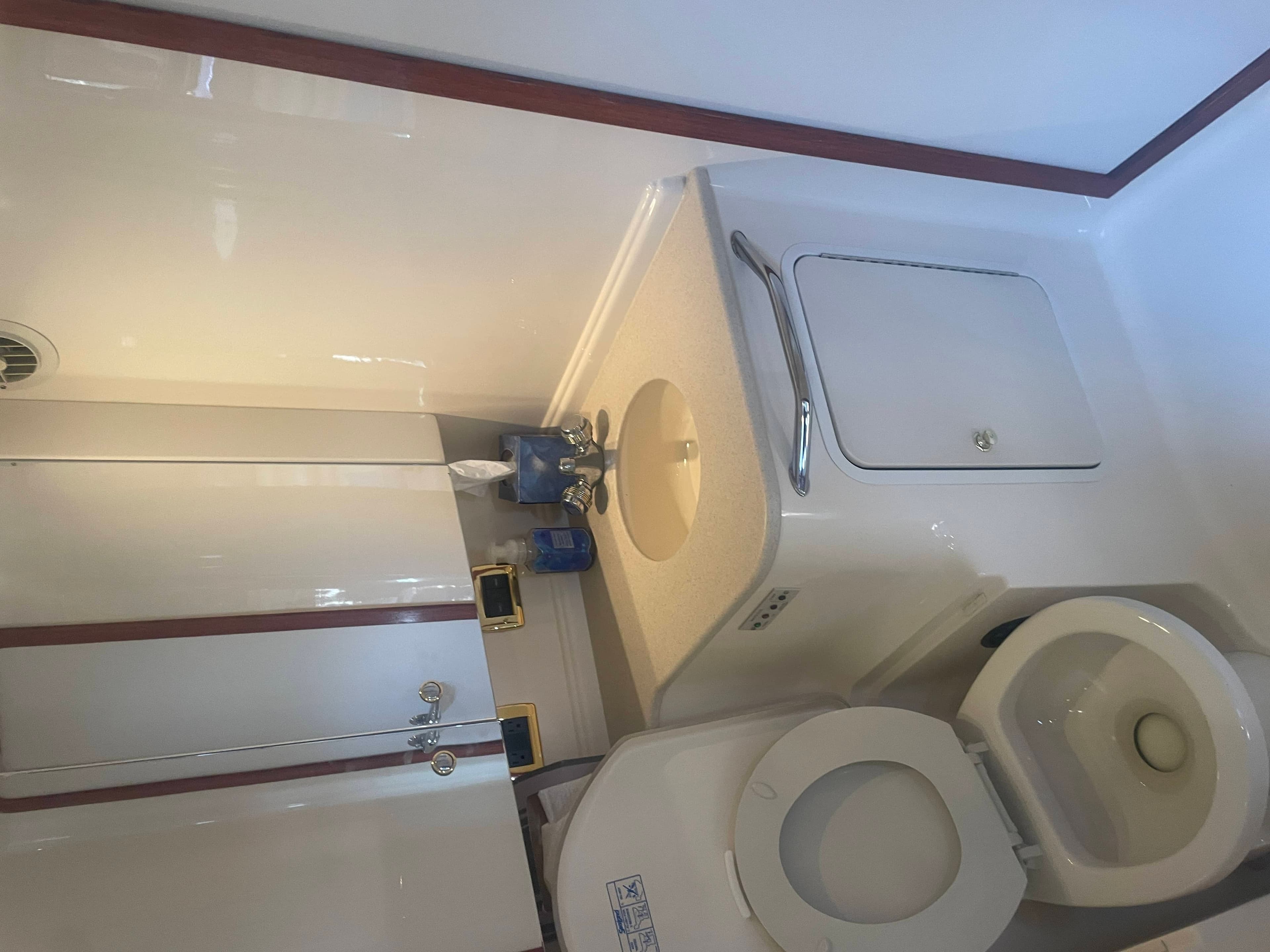 2001 Sea Ray Sundancer 460 engine room with twin Cummins diesels