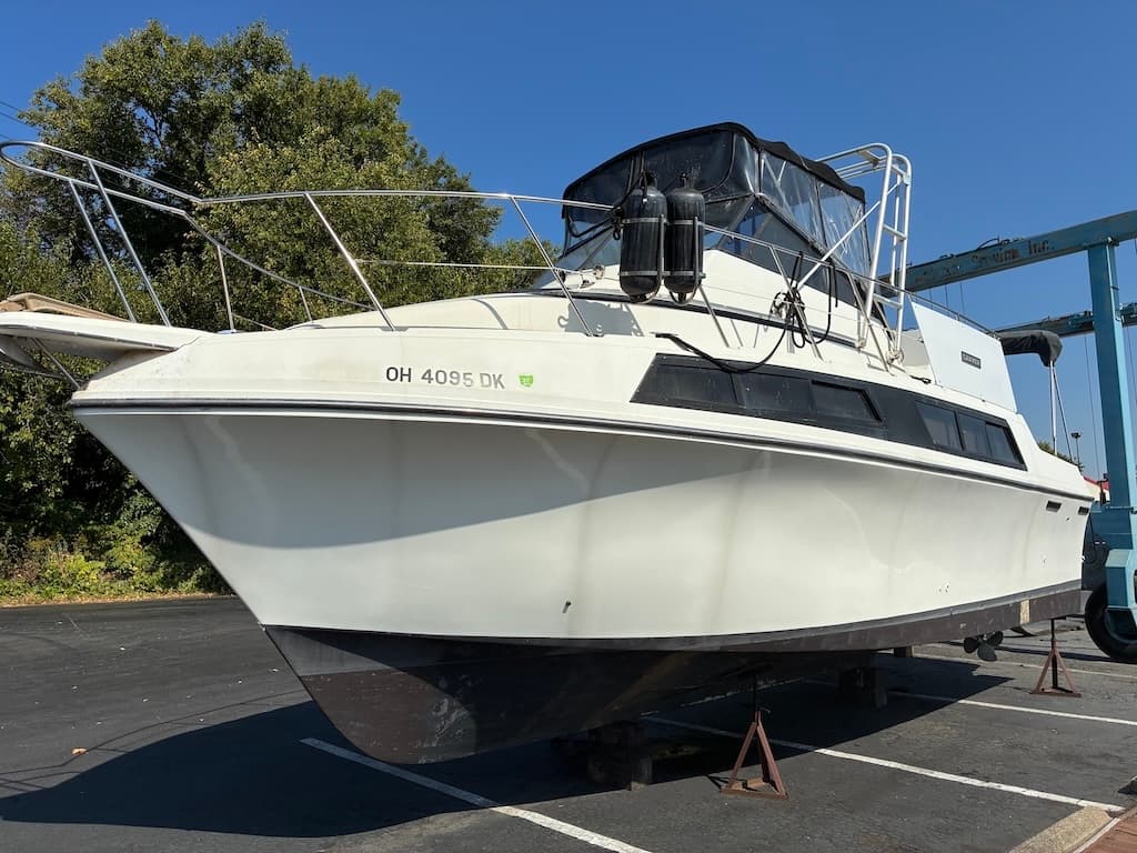 1987 Carver 32 Mariner flybridge cruiser profile view for sale in Cleveland on Lake Erie