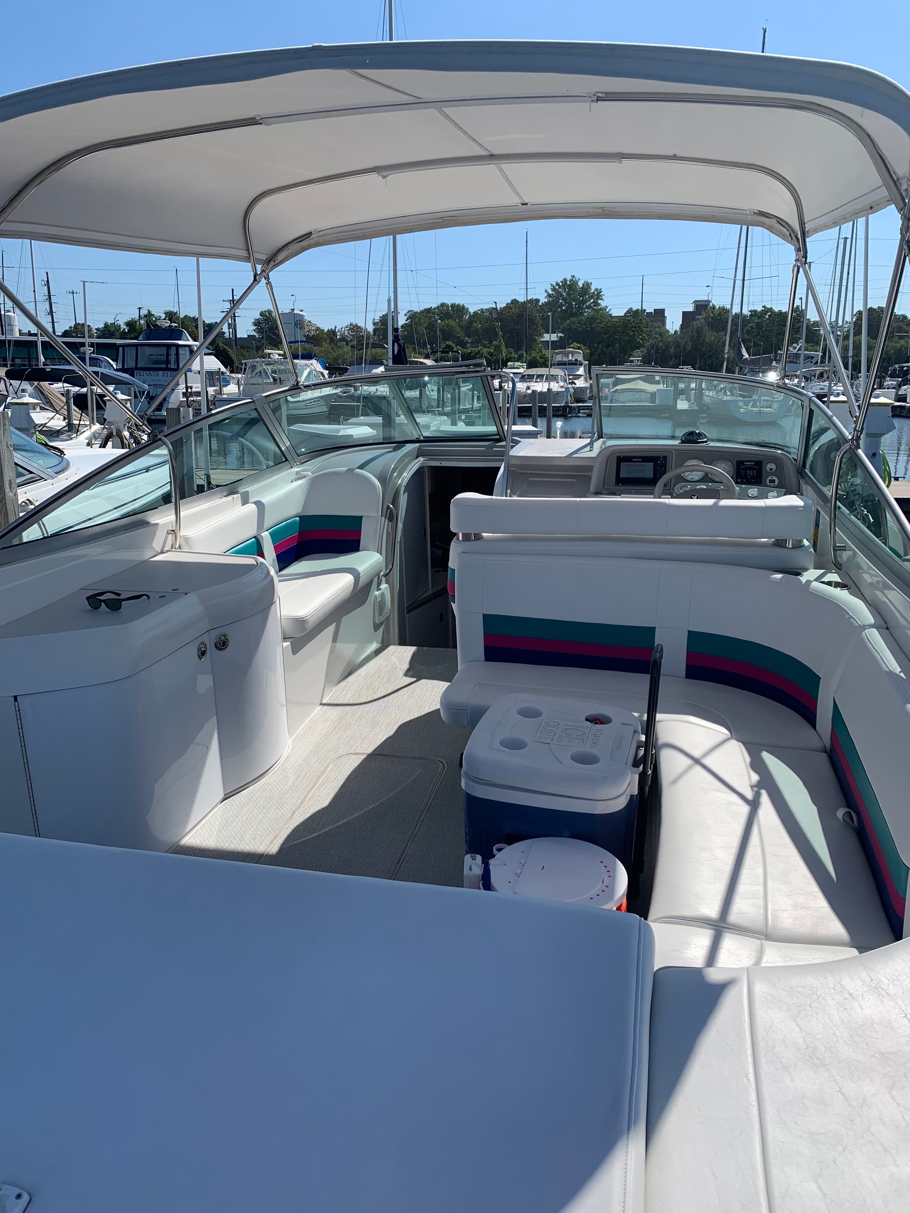 1998 Formula 330 SS helm station with Simrad GPS, compass, and VHF radio