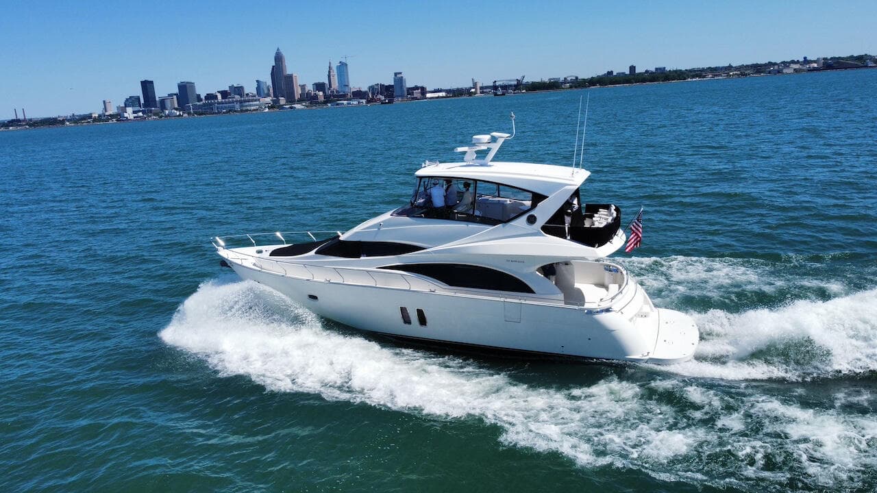 A Marquis 57 cruising Lake Erie with the Cleveland skyline, a top quality yacht you may find at the Cleveland Boat Show