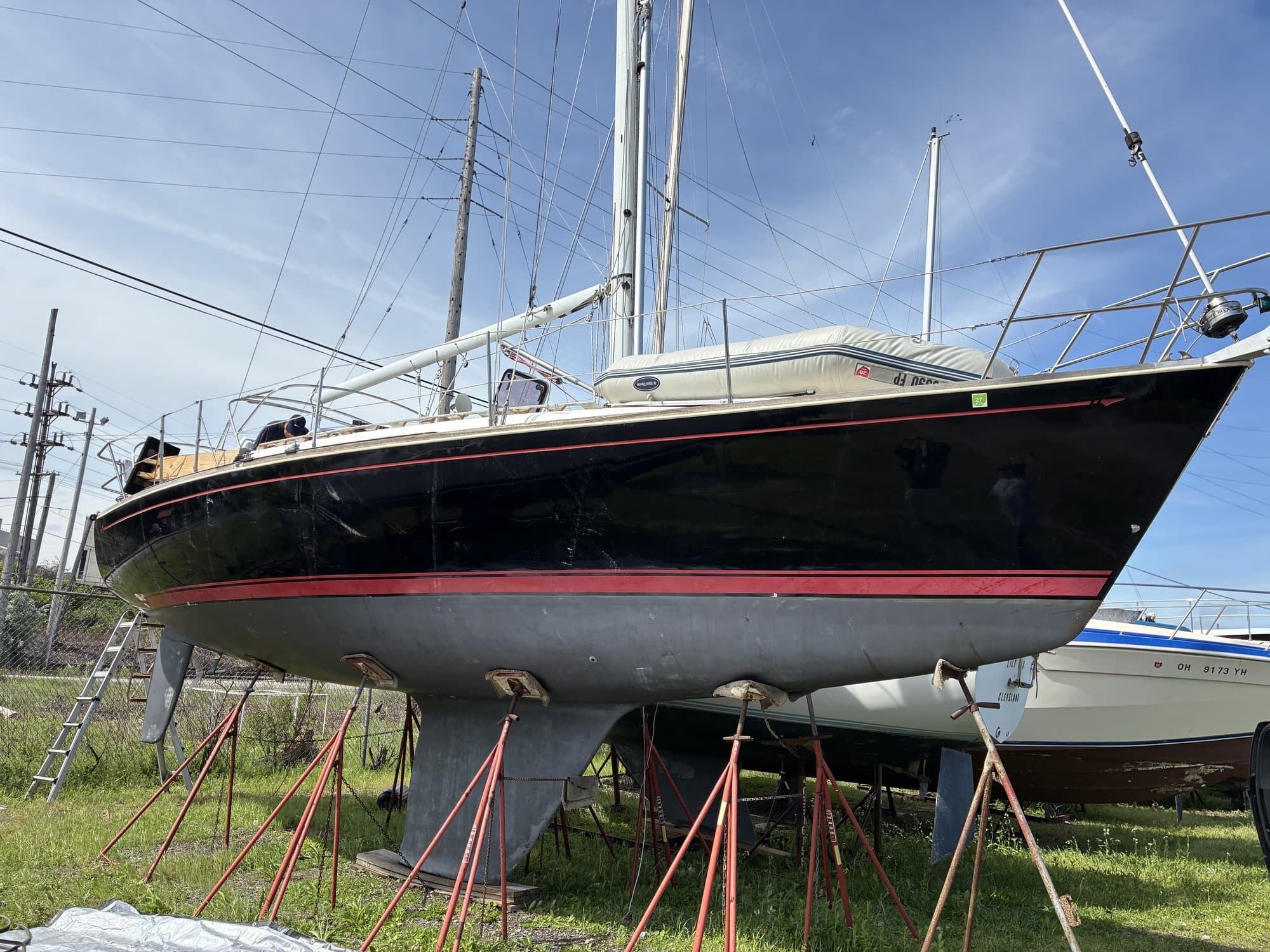 Sailboat hauled out and blocked on jack stands for winter storage near Cleveland