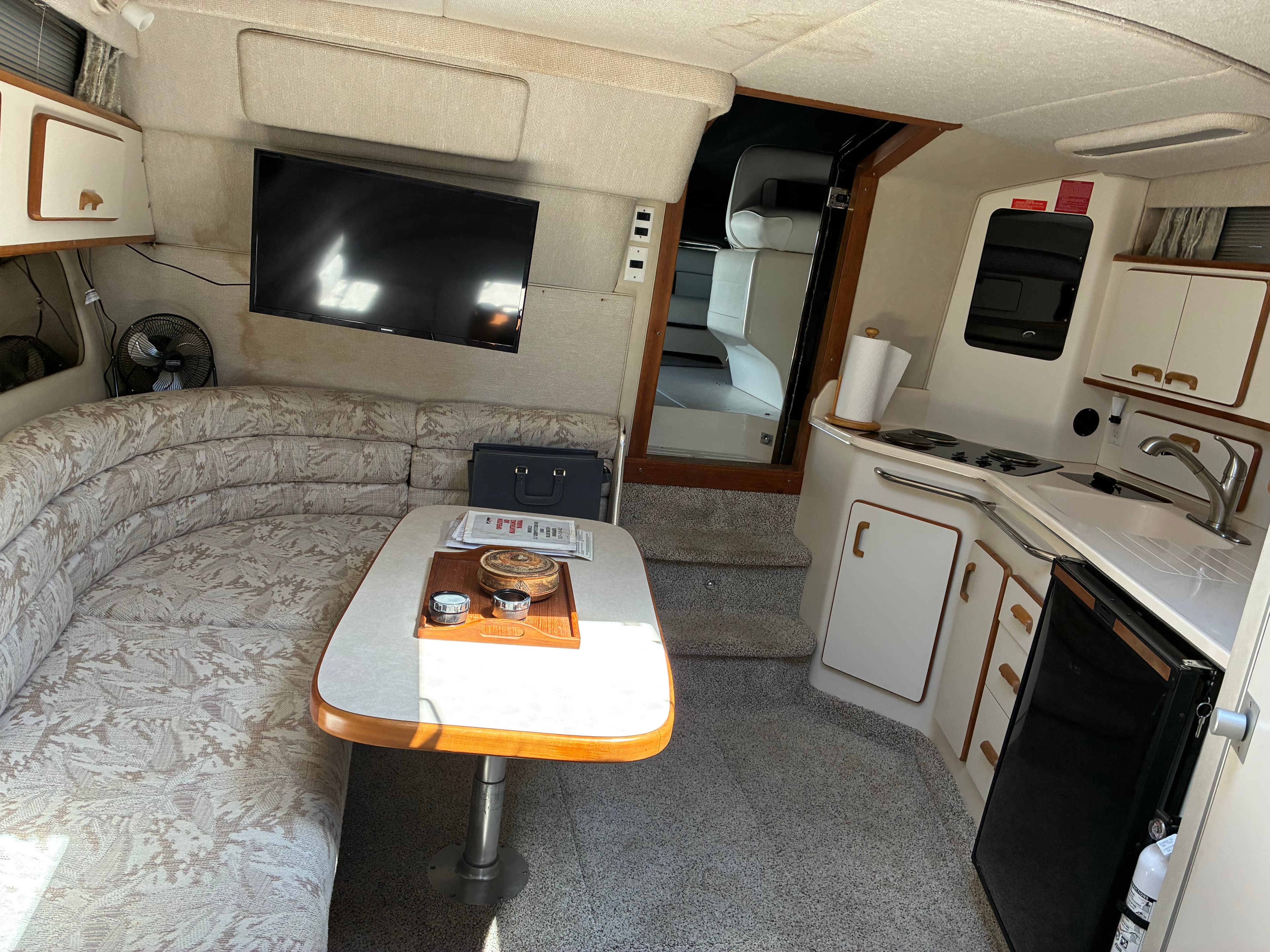 1990 Sea Ray 350 Express Cruiser cabin overview showing galley and head entry