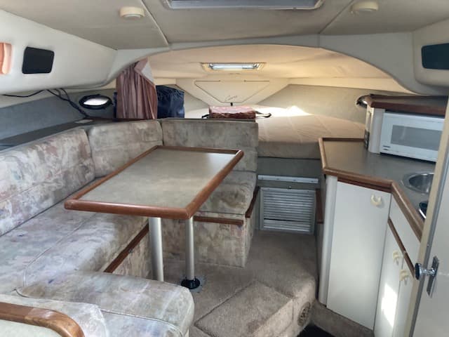 1994 Bayliner 3055 cabin overview with galley, dinette, and V-berth