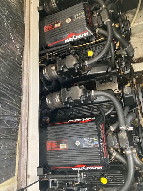 1994 Bayliner 3055 engine bay with twin MerCruiser 5.0L LX V-8 sterndrives