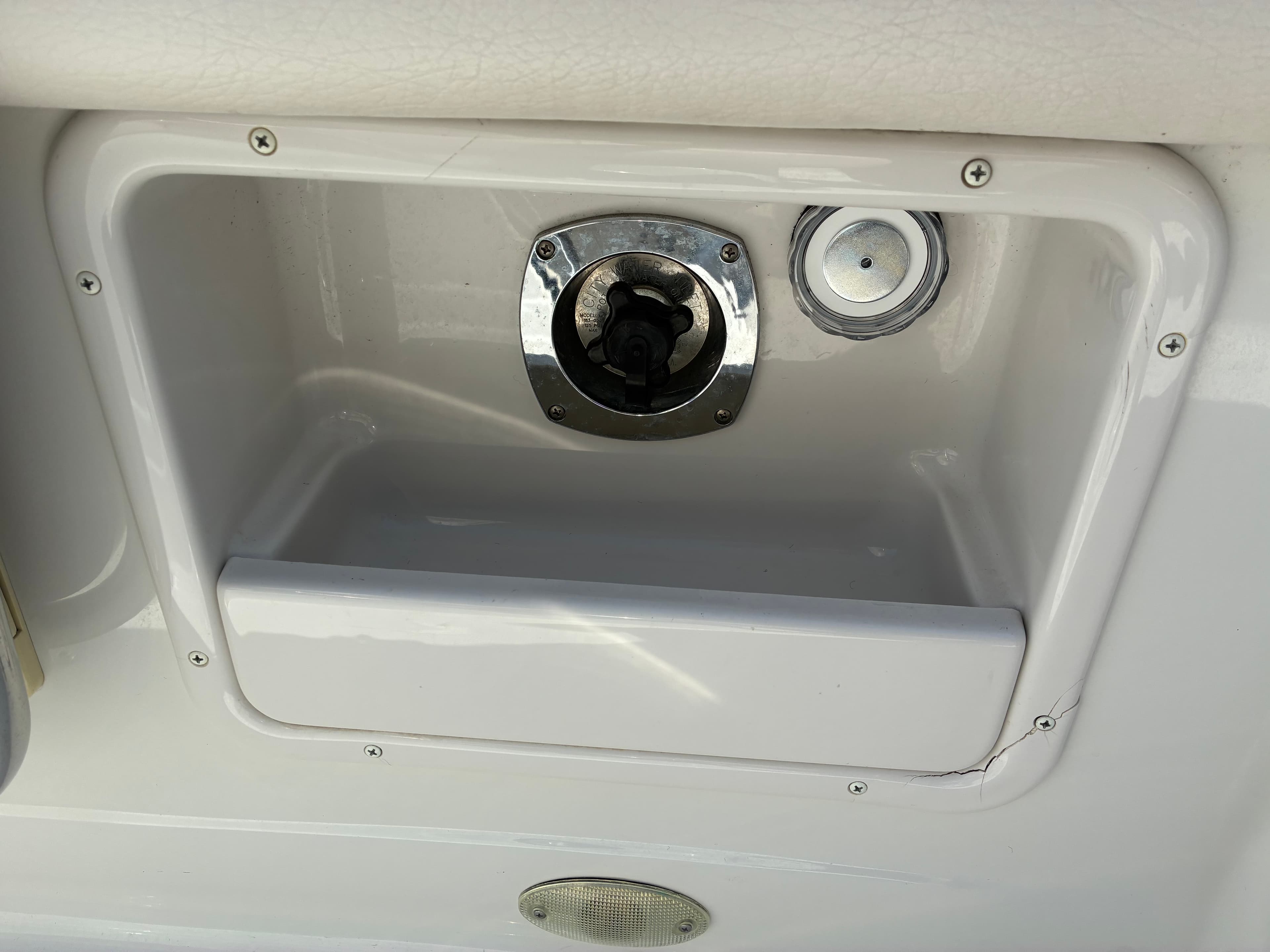 2005 Crownline 270CR dockside water and shore power inlet